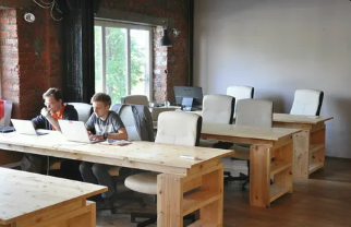 Warehouse packing station with recyclable packaging supplies